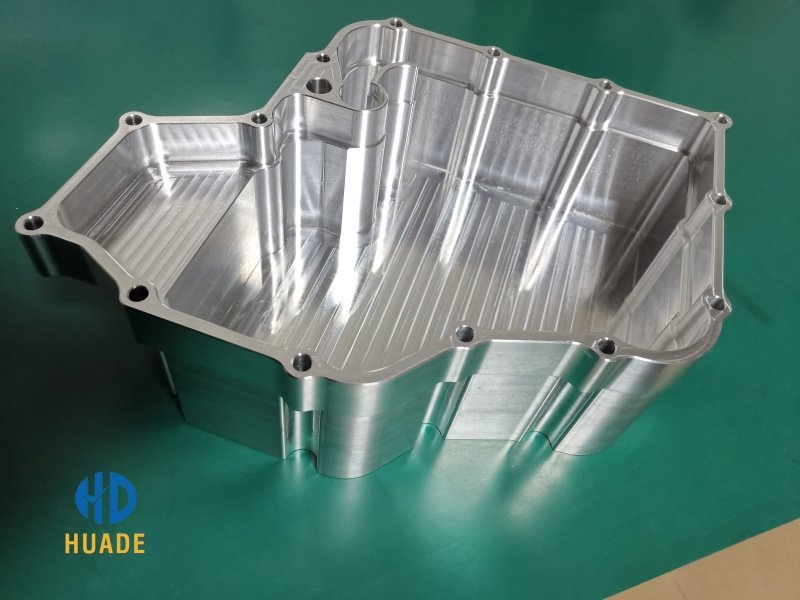 A close-up shot showing a complex, high-precision machined part with a flawless surface finish.